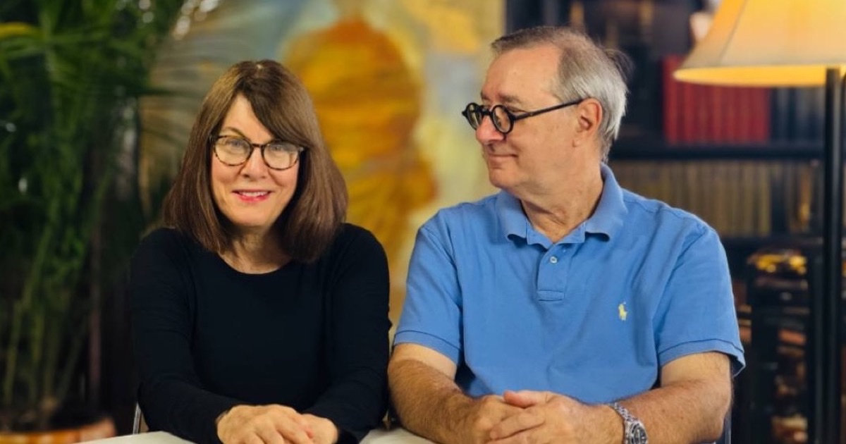 Joymind co-founders Rochelle L. Cook and Michael Glock, PhD, seated together at a table